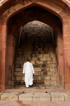 Man walking up stairs in India