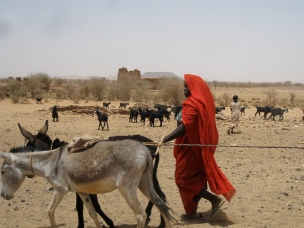 Woman in red in Sudan